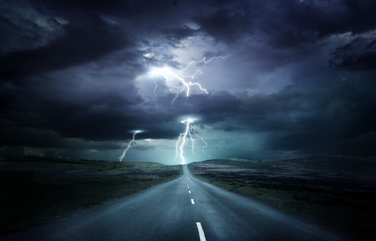 Extreme weather. Landscape with a road, thunderstorm, lightning, risk. Photo composition.