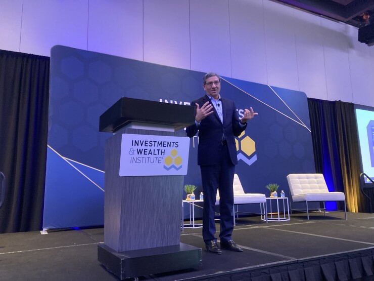 Surya Kolluri, the head of TIAA Institute, speaks at the Investments & Wealth Institute's conference for hnw advisors in New York on Nov. 30, 2023.jpg