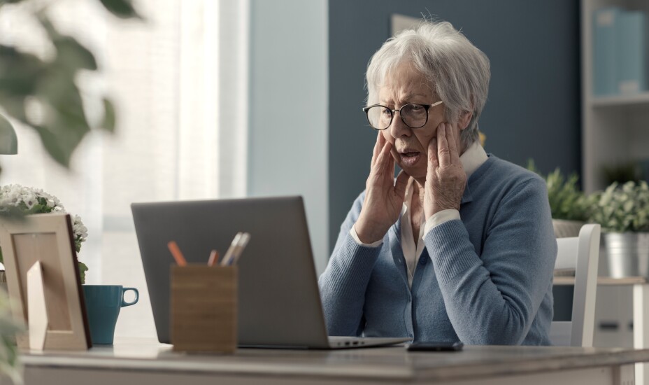 Senior woman struggling with technology