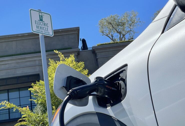 Photo of an electric car charging at a mall parking lot in California.