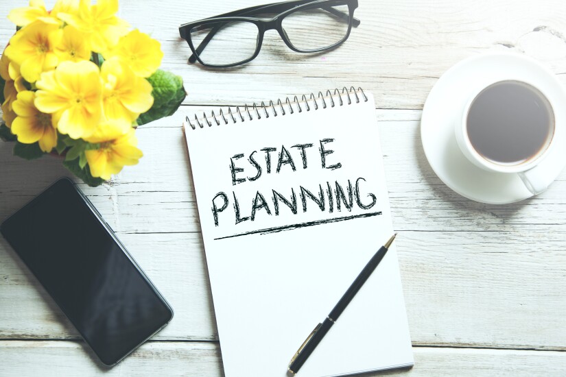 Estate planning - notepad, glasses, coffee and phone